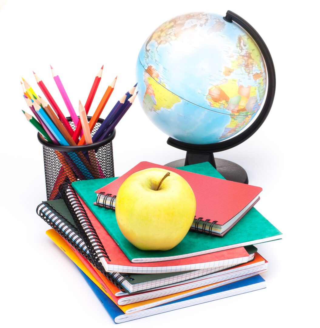Globe, notebook stack and pencils. Schoolchild and student studies accessories. Back to school concept.